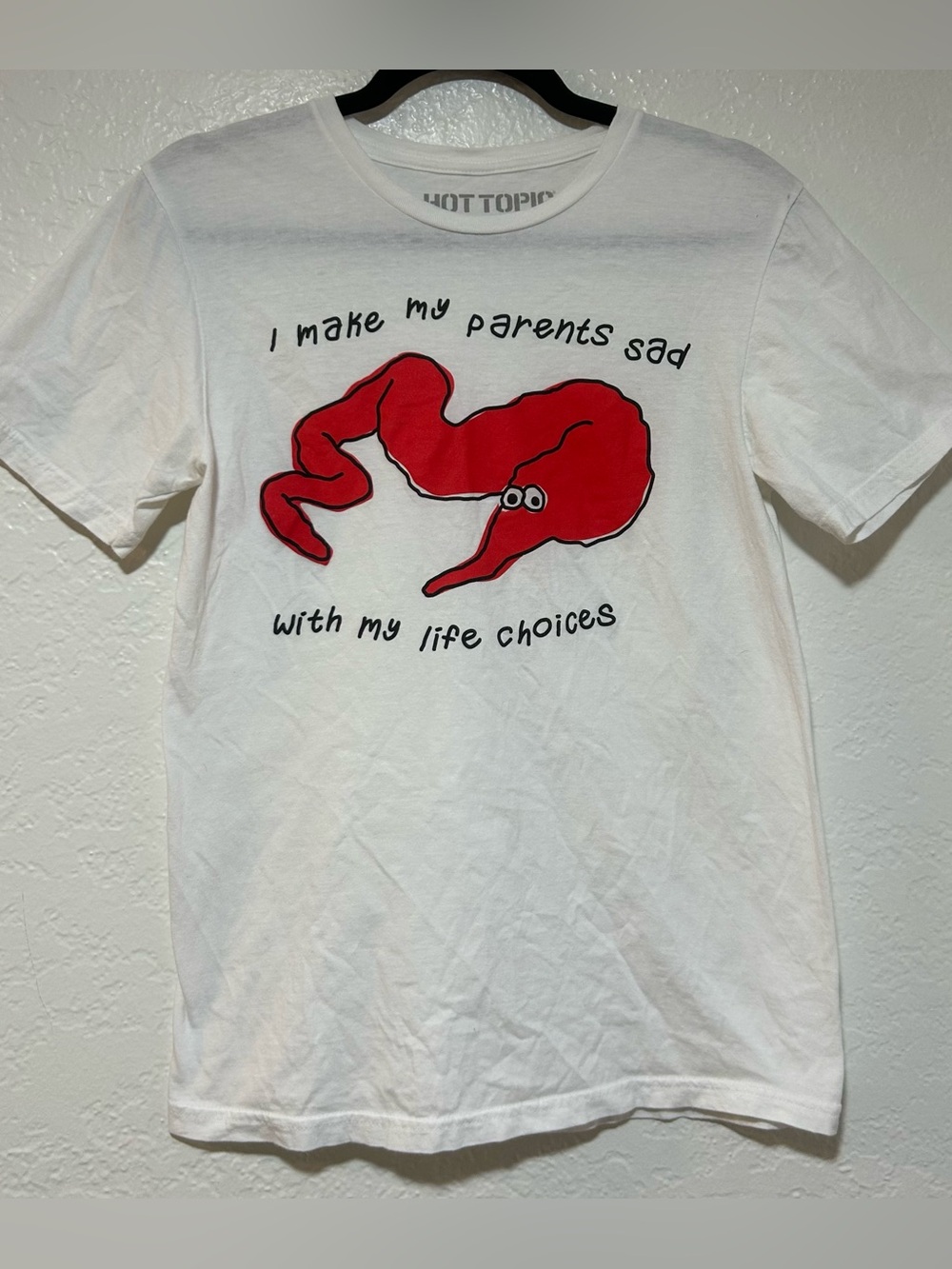 Hot Topic “I Make My Parents Sad” White Tee with Red Tapeworm (?)